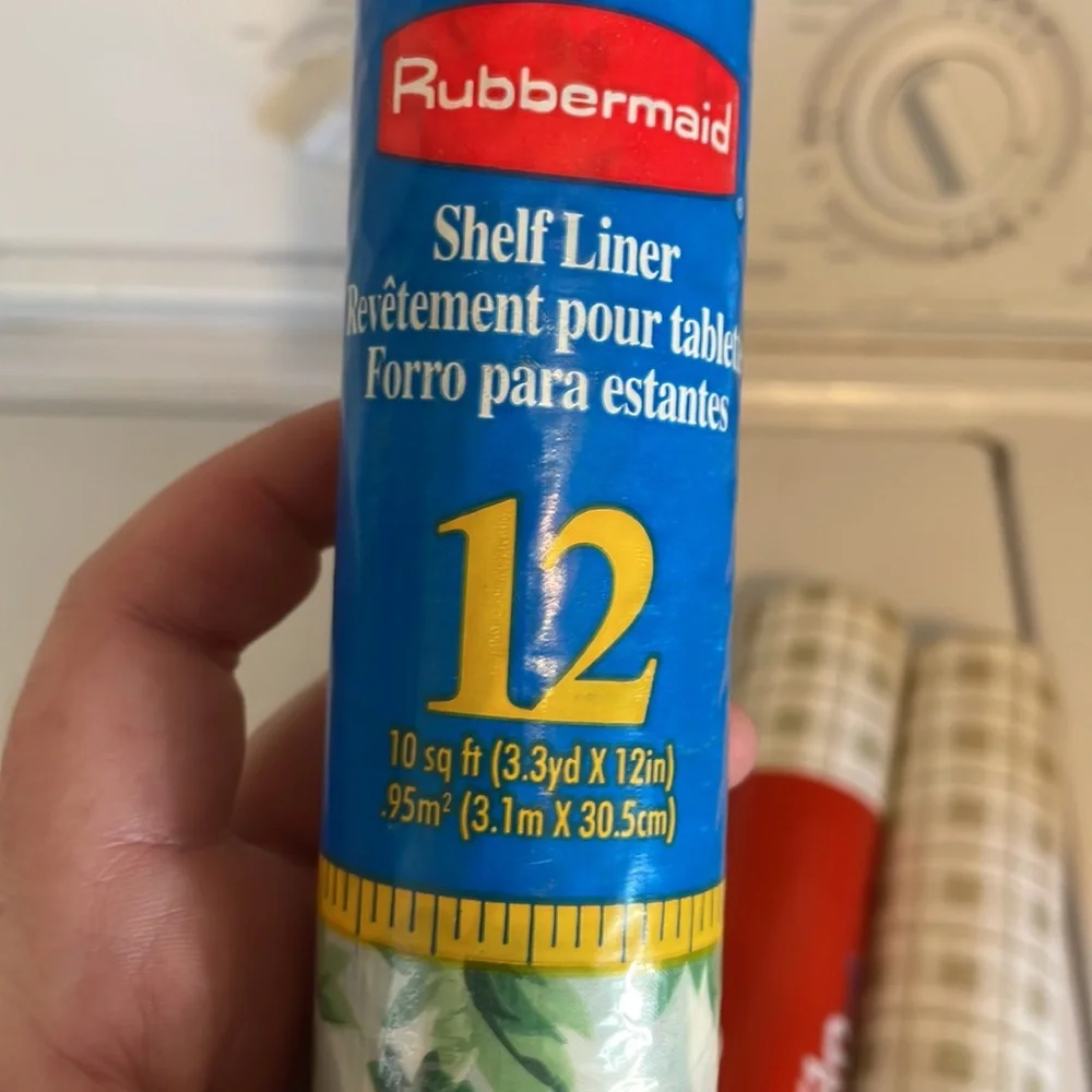 Five rolls of Rubbermaid shelf liner, some adhesive some not 3 full new rolls